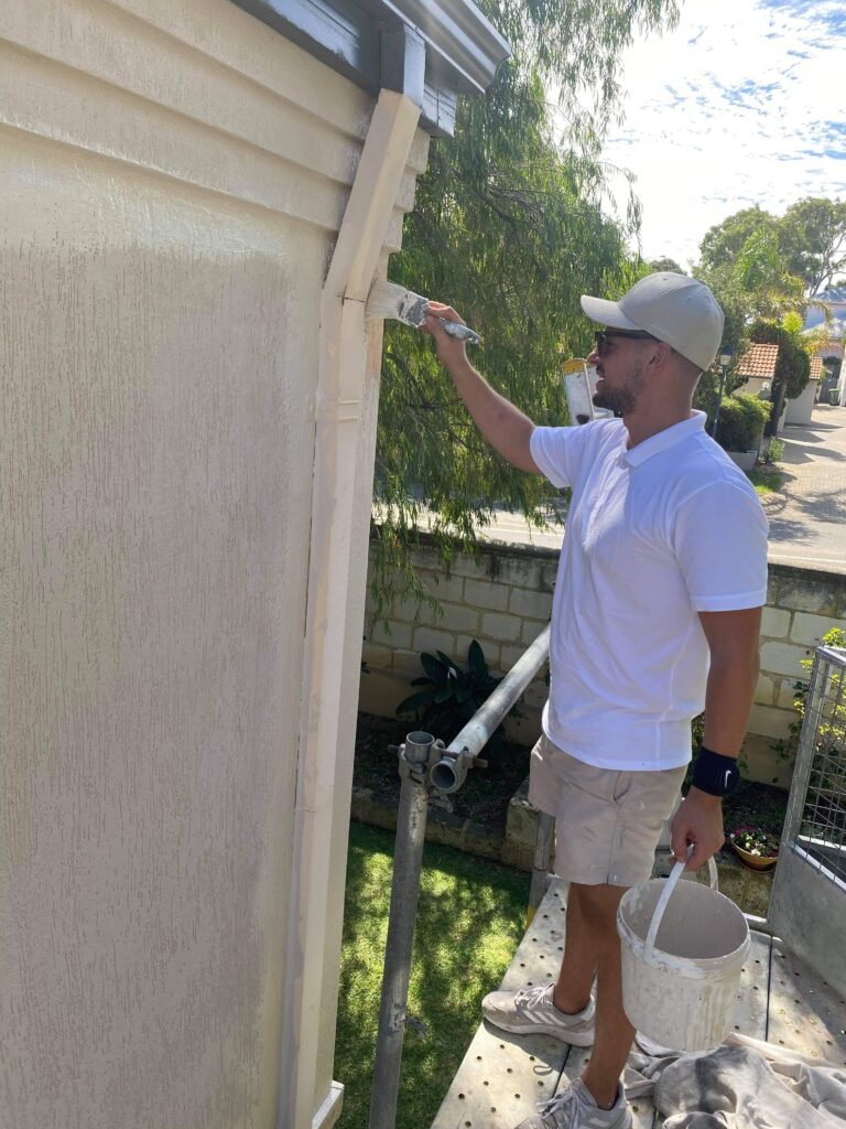 Outside house painting on eaves, gutters and fascia